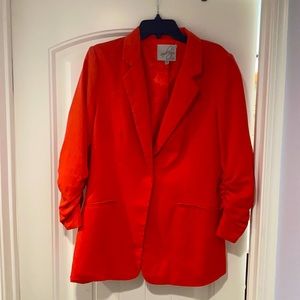 Coral colored size large women’s blazer
